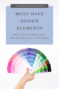 Must-have Design Elements text on white background with a fanned out pantone color swatch book